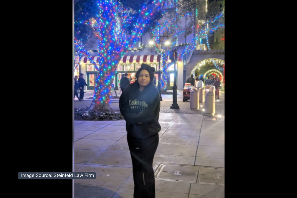 Celeste Rivas Hernandez standing in front of lighted tree